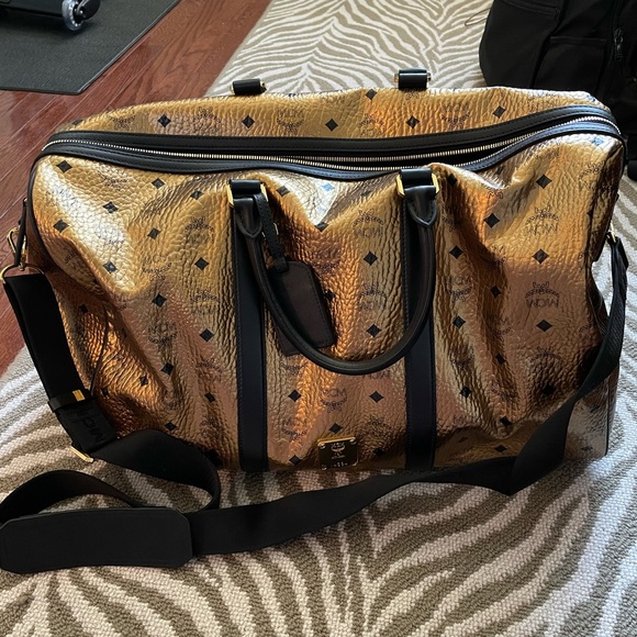 MCM Handbags - Brand new gold metallic MCM duffel!!